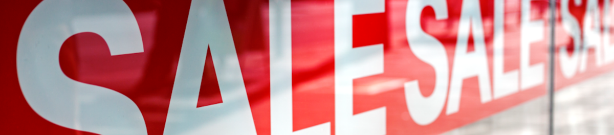 Bright red sale banner with bold whiteSALE" text, promoting Black Friday special offers on gifts and tech products, ideal for retail advertising.