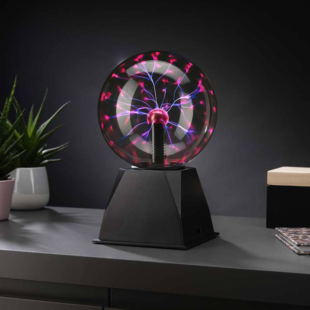 6-inch plasma ball with a clear glass globe, vivid pink and purple arcs, and a black base, glowing as desk decor.