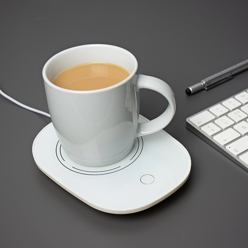 Buy USB Cup Warmer to keep your coffee hot at your desk. Sleek white beverage warmer with mug, ideal for office or home use.