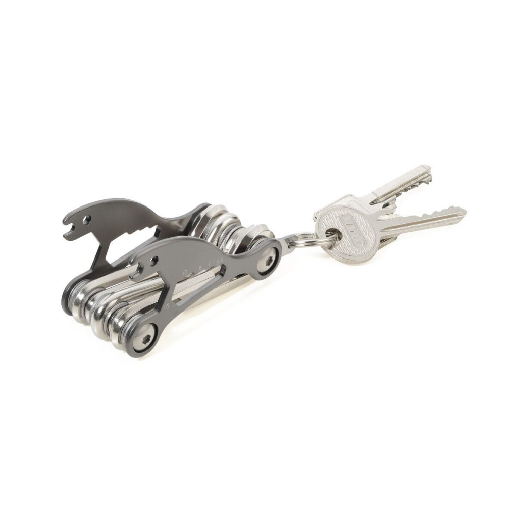 Troika Bike Multitool with 18 functions including hex keys, screwdrivers, and wrenches, attached to a keyring with two keys. Compact and portable.