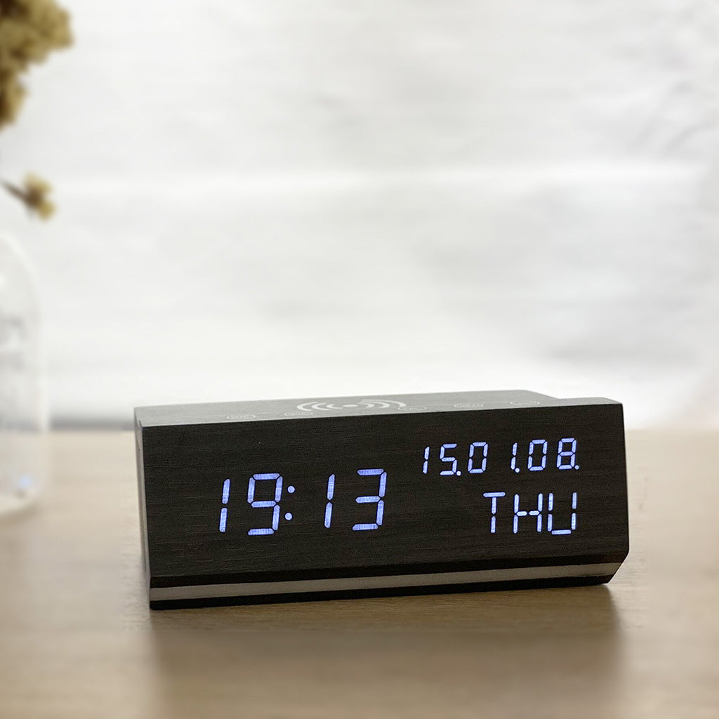 Shop Wireless Charging Wood Alarm Clock with LED display showing time, date, and day. Sleek black wood finish, perfect for bedside or desk use.