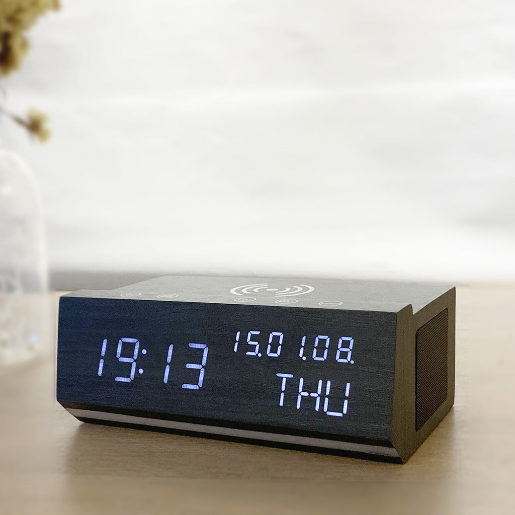 Shop Wireless Charging Wood Alarm Clock with LED display, Bluetooth speaker, and FM radio. Ideal for bedside or desk use in modern home decor.