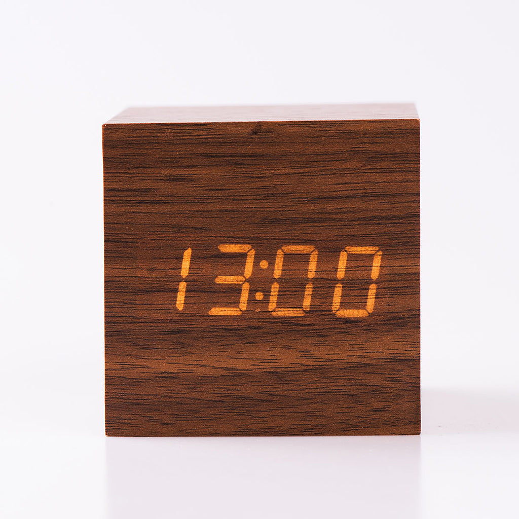 Buy Eco-Friendly Dark Wood Alarm Clock with LED display in cube design. Stylish bedside clock for modern bedrooms, powered by USB or batteries.