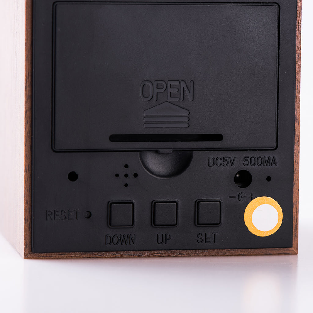 Back view of Eco-Friendly Wood Cubee Alarm Clock showing control buttons, battery compartment, and DC5V input. Ideal for modern bedrooms.