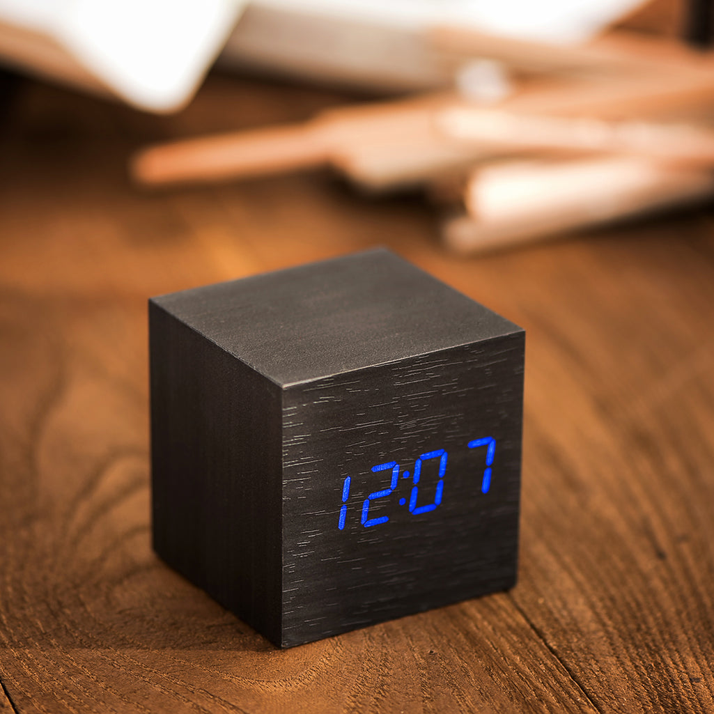 Buy Eco-Friendly Wood Alarm Clock black with LED time display in cube design. Stylish black bedside clock for modern home decor and gifting.