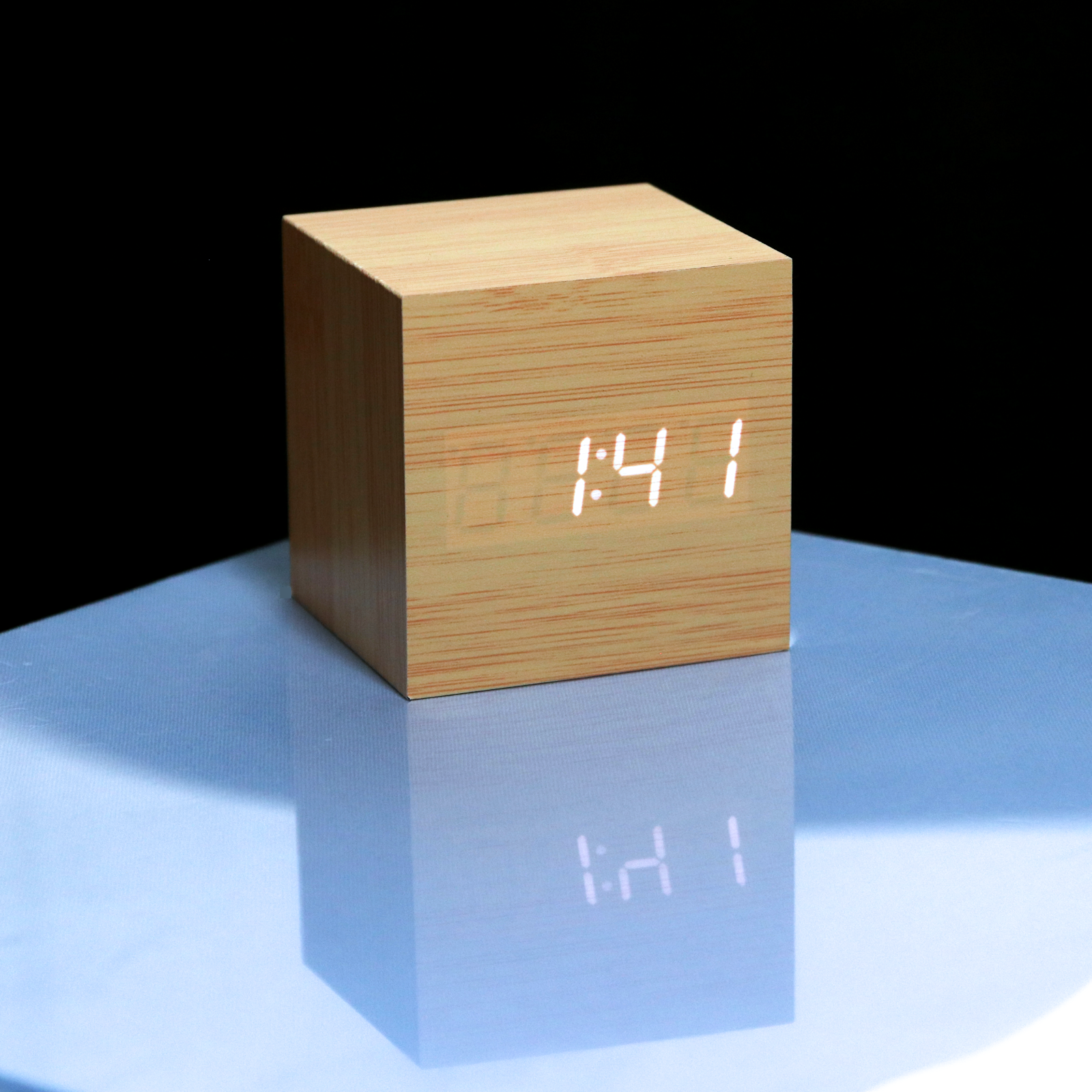 Buy Eco-Friendly Wood Alarm Clock with LED display in cube design. Stylish bedside clock for modern bedrooms, powered by USB or batteries.