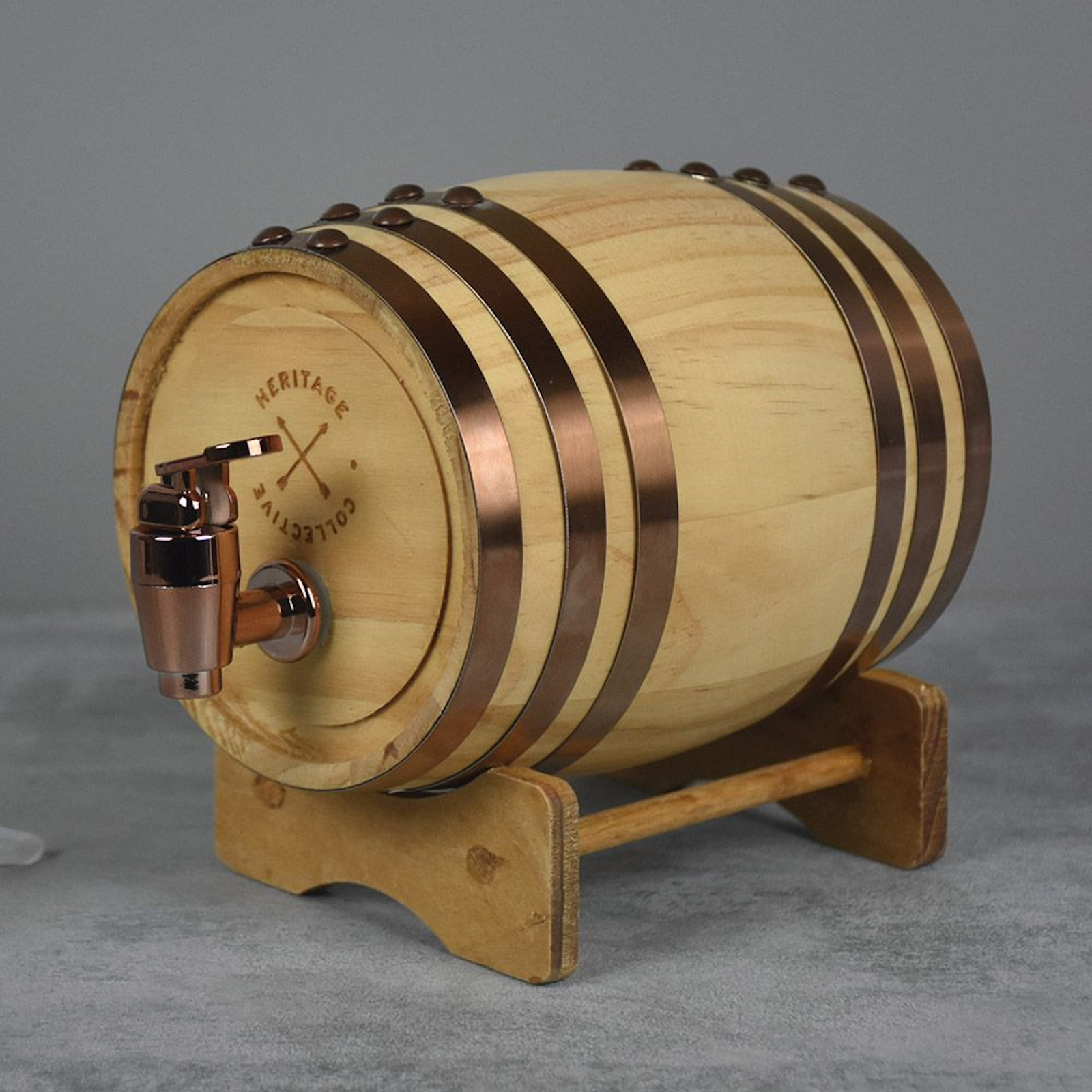 Heritage Collection Whiskey Barrel with copper spout and wooden stand, perfect home gadget for spirit dispensing and gifting.