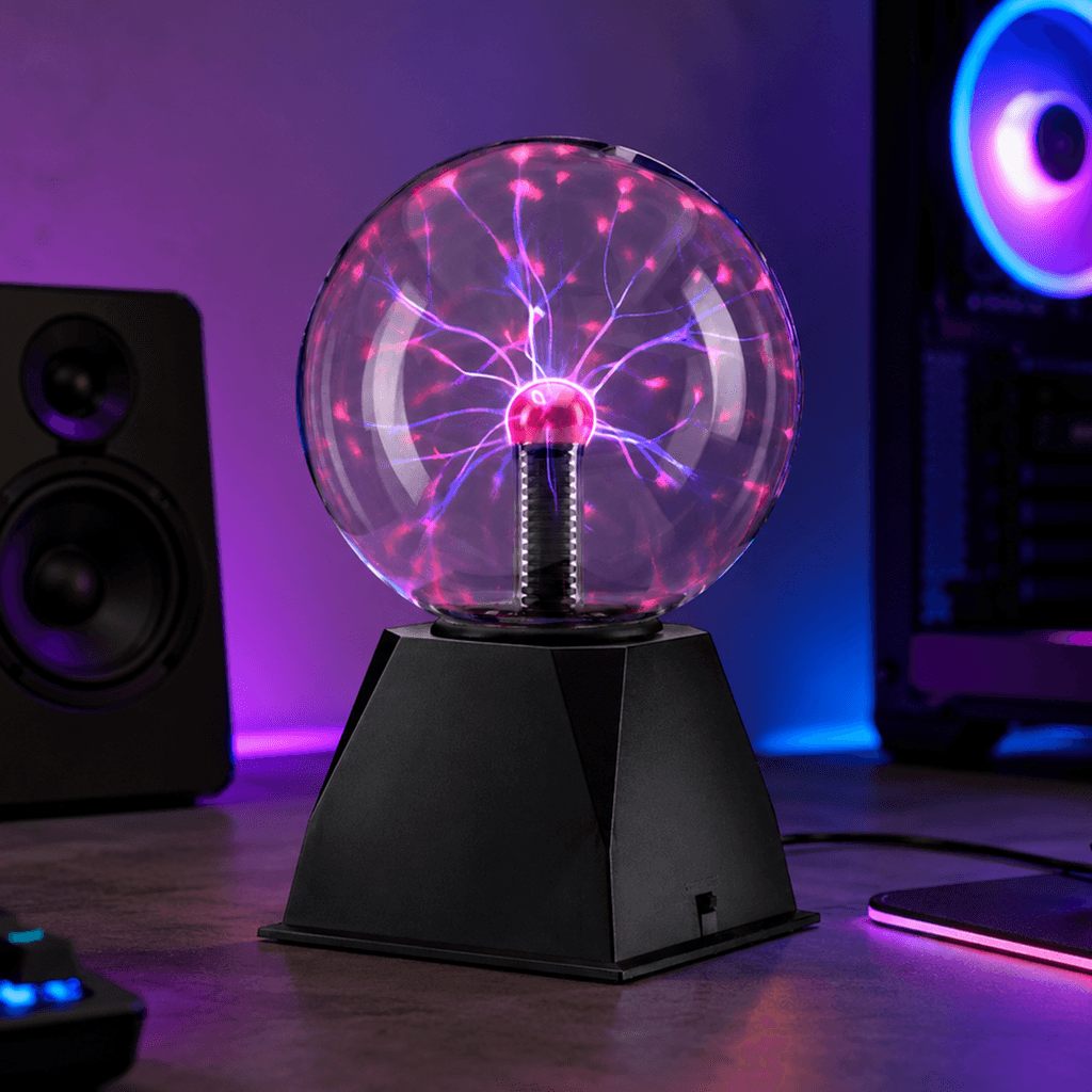 Six-inch plasma ball with a clear glass globe, pink and violet electric arcs, and a black USB-powered base for desk decor.