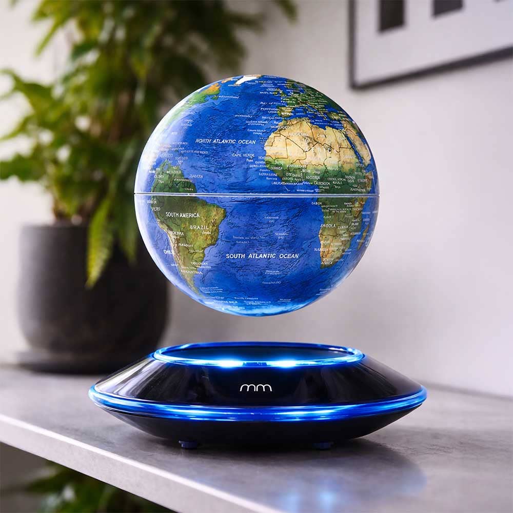 Floating Levitating Globe of the world with blue led lights with plant in background